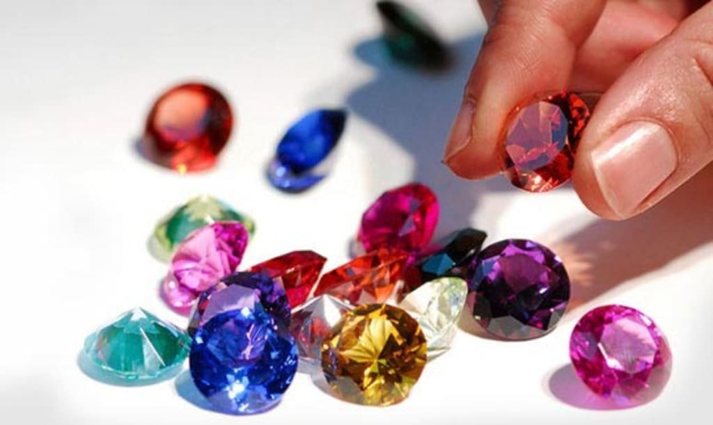 An assortment of cut, faceted gemstones